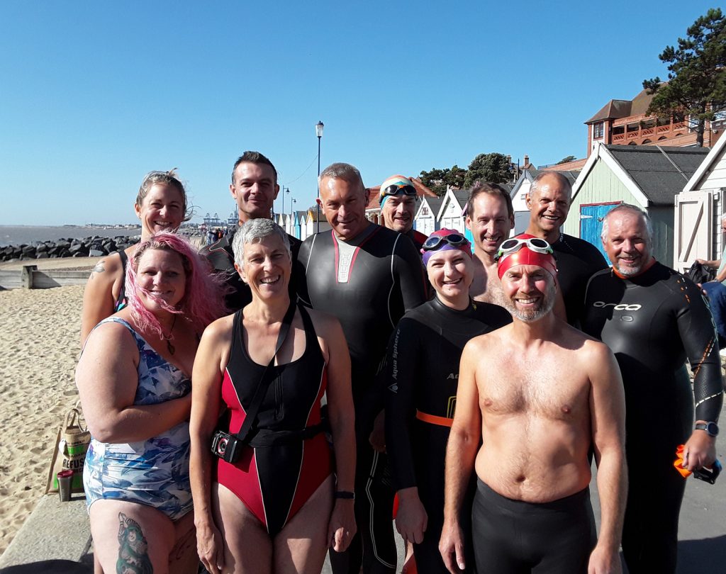 swimmers posing at the seaside