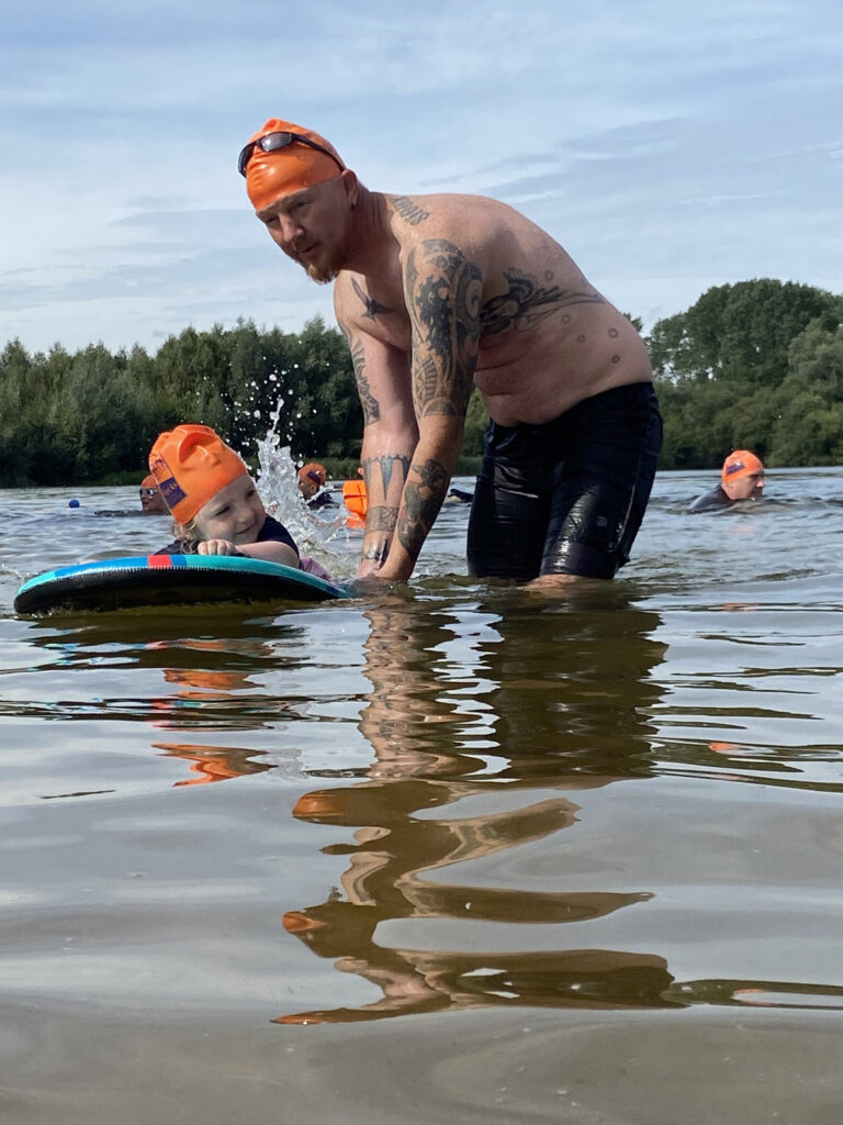 child and dad in water