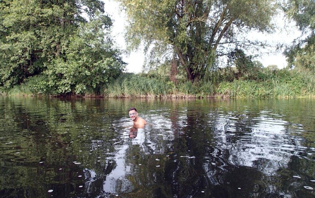 swimmer in river trees