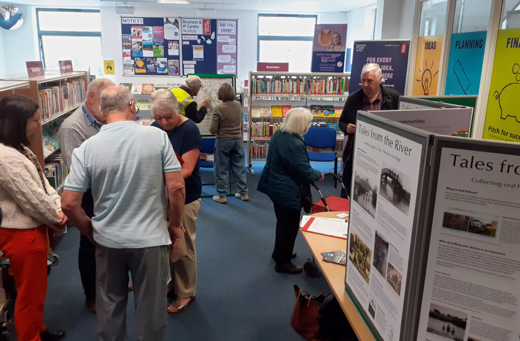 people and displays in library