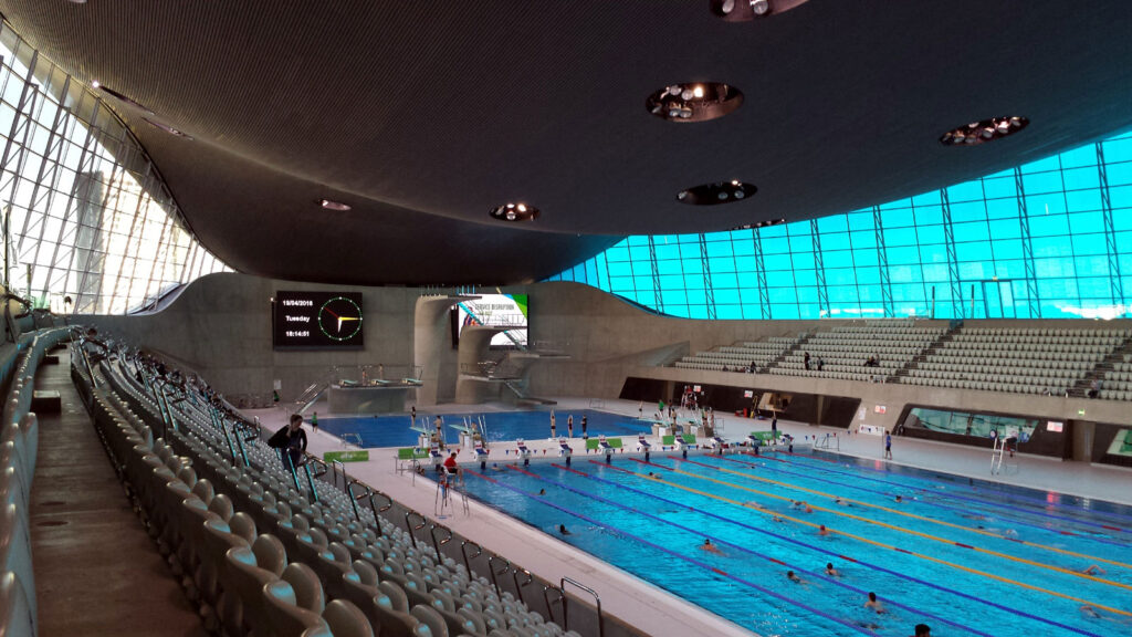 large swimming pool with curved roof, from gallery
