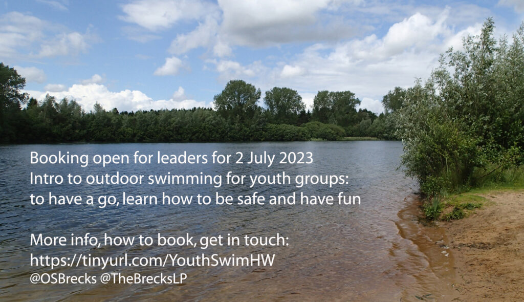 Image of a calm lake, sandy beach and blue sky, with text: Booking open for leaders for 2 July 2023 Intro to outdoor swimming for youth groups: to have a go, learn how to be safe and have fun. More info, how to book, get in touch. https://tinyurl.com/YouthSwimHW @OSBrecks @TheBrecksLP