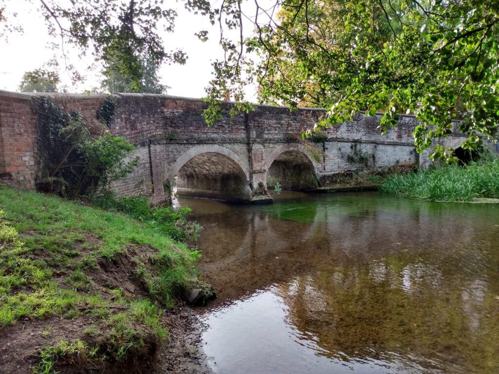 historic bridge with shallow water