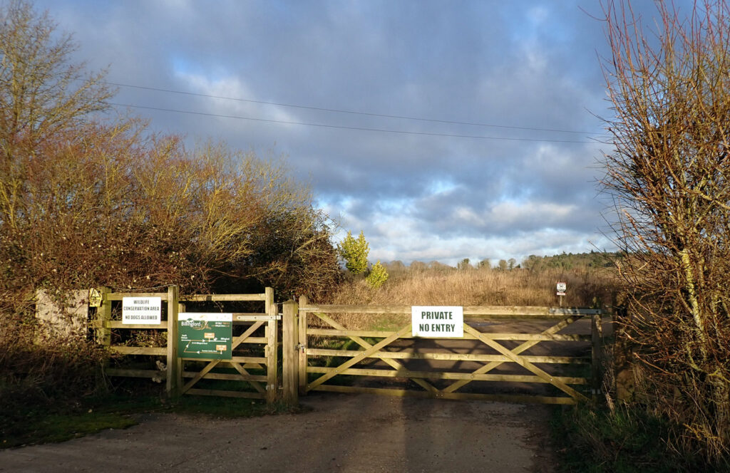 signs on the gate saying ‘Private No Entry’