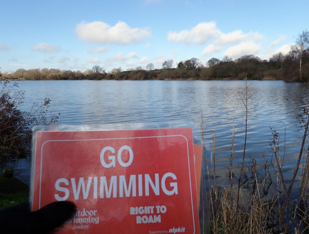 Go Swimming sign at a lake